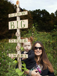 Gardeners with garden sign